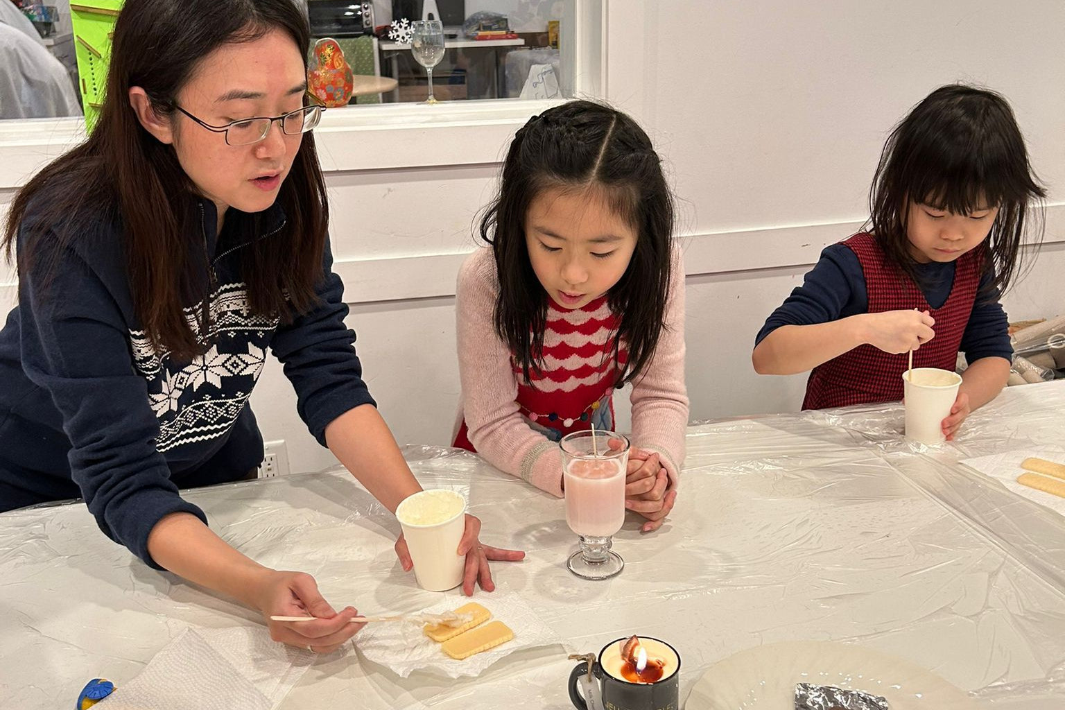 Candle instructor guiding participants during a class.