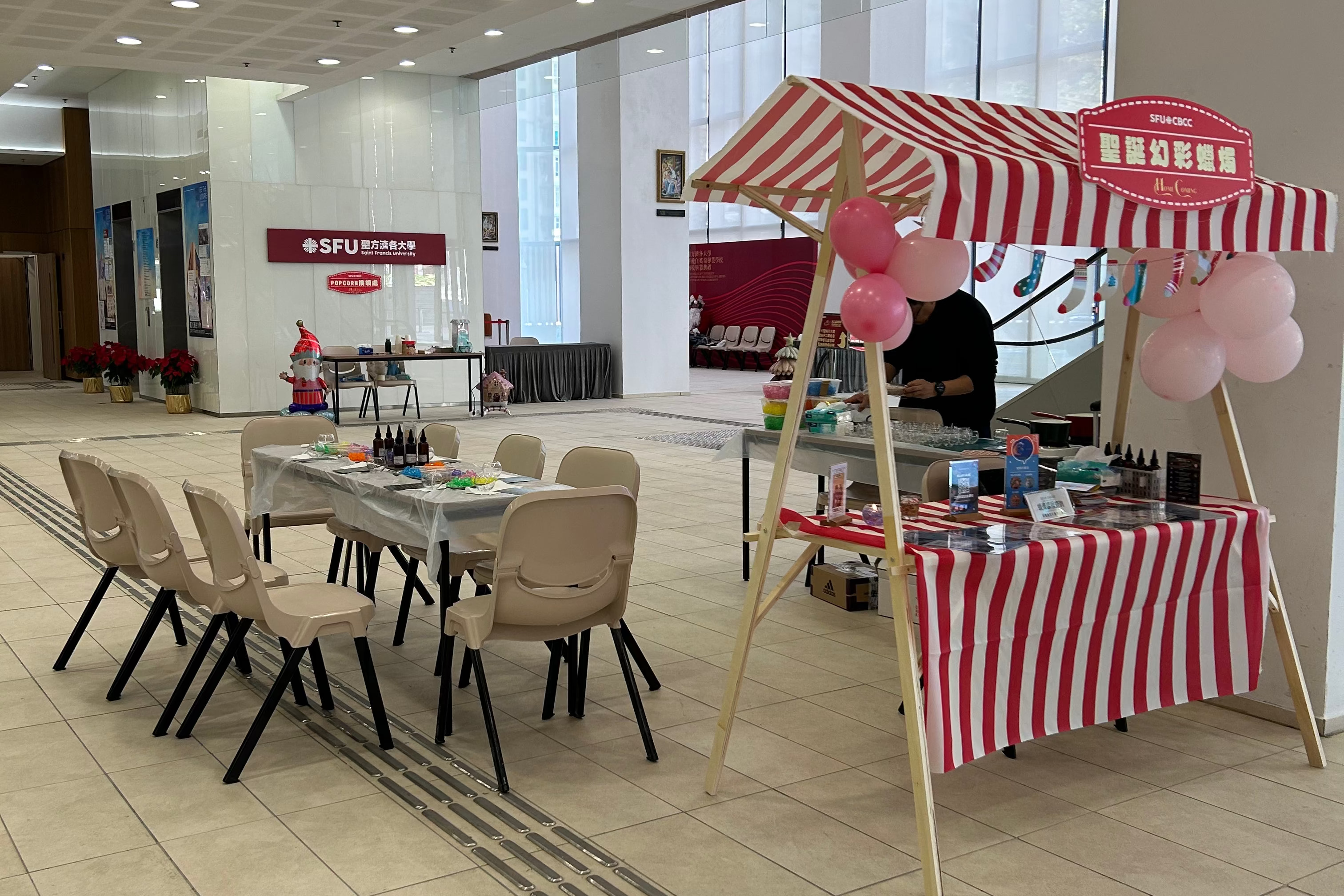 Setting up a pop-up candle making station at a homecoming event for graduated students at university during Christmas season.