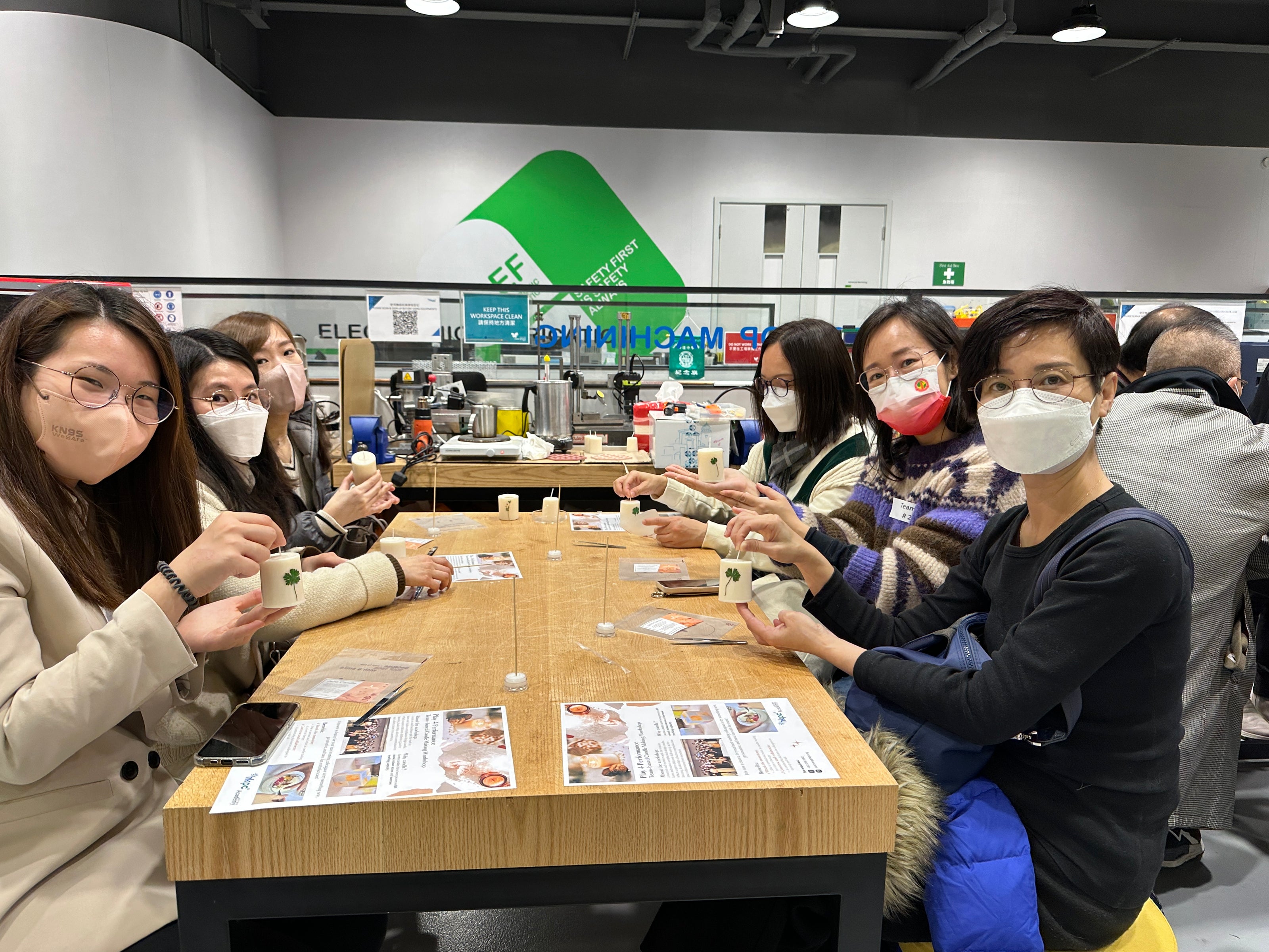 Corporate group creating candles at a workshop tailored to budget and goals