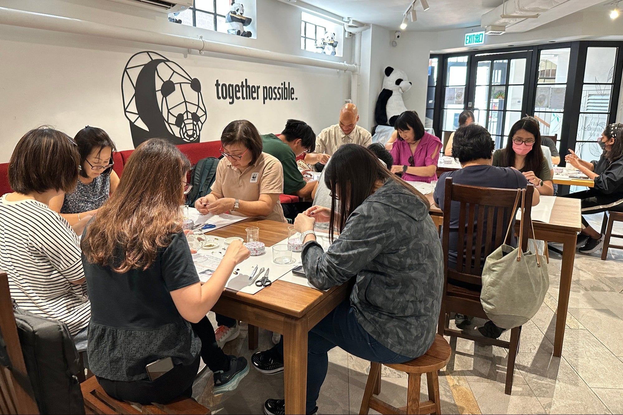 NGO members joining sustainable candle making activity